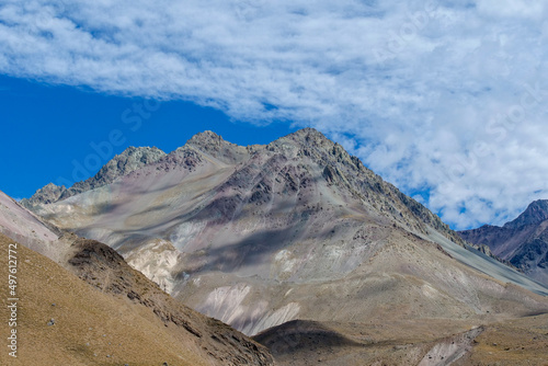 Grey mountain peaks at Valle de Colina, Cajón del Maipo at San Miguel in Chile, a popular tourist destination.
