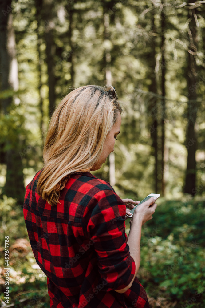 Woman Using Phone In Nature. Woman Using Phone In Nature.