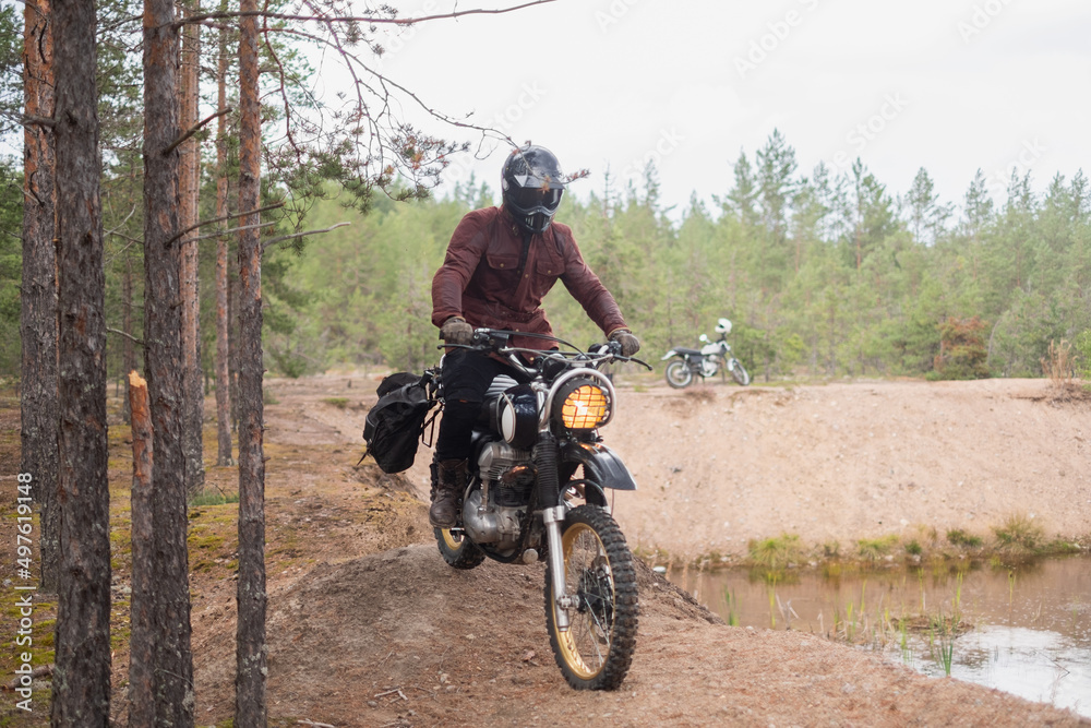Rider landed after jumping in the wood Rider landed after jumping in the wood
