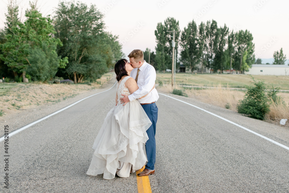 Bride and Groom Kissing in Middle of Street Bride and Groom Kissing in Middle of Street