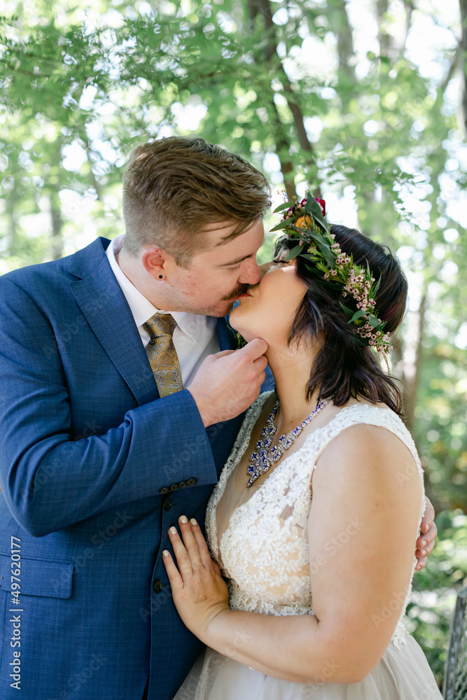 Bride Wearing Flower Crown Kisses Groom Bride Wearing Flower Crown Kisses Groom
