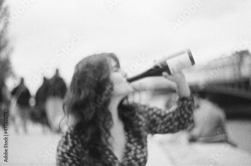 Brunette drinking wine photo