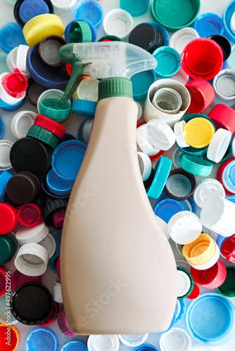 Plastic bottle on a pile of caps