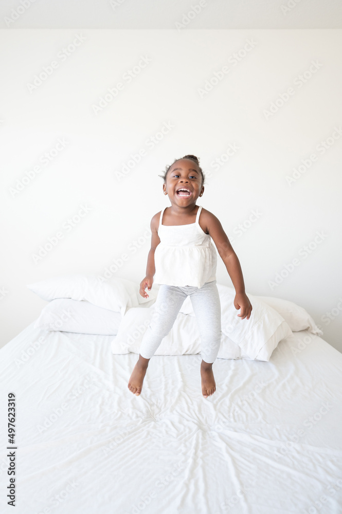 Carefree toddler on bed Carefree toddler on bed