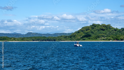 Boat moored in the bay in front of Tamarindo, Guanacaste, Costa Rica
