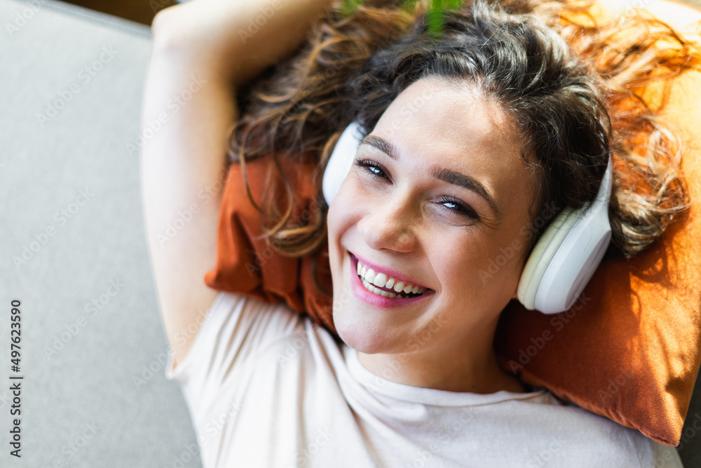 Portrait of a woman smiling and wearing headphones Portrait of a woman smiling and wearing headphones