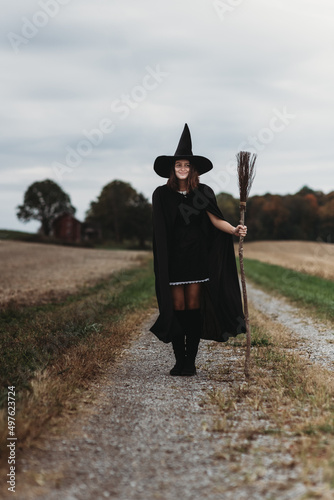 Witch with a broom photo