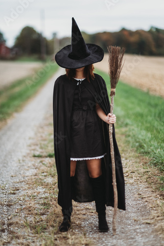Witch with a broom photo