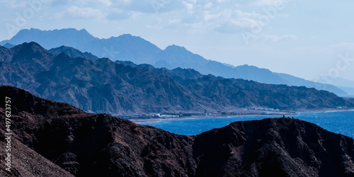 panorama in mountain range at sinai egypt similar to Martian landscapes with sea view and old town