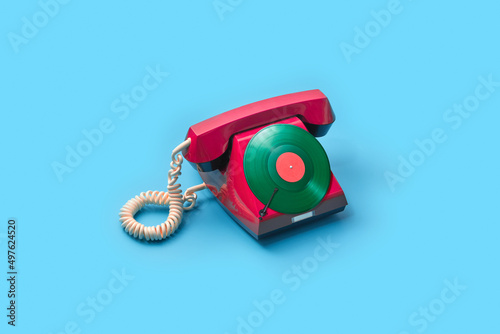 Retro style telephone with vinyl disk instead buttons photo