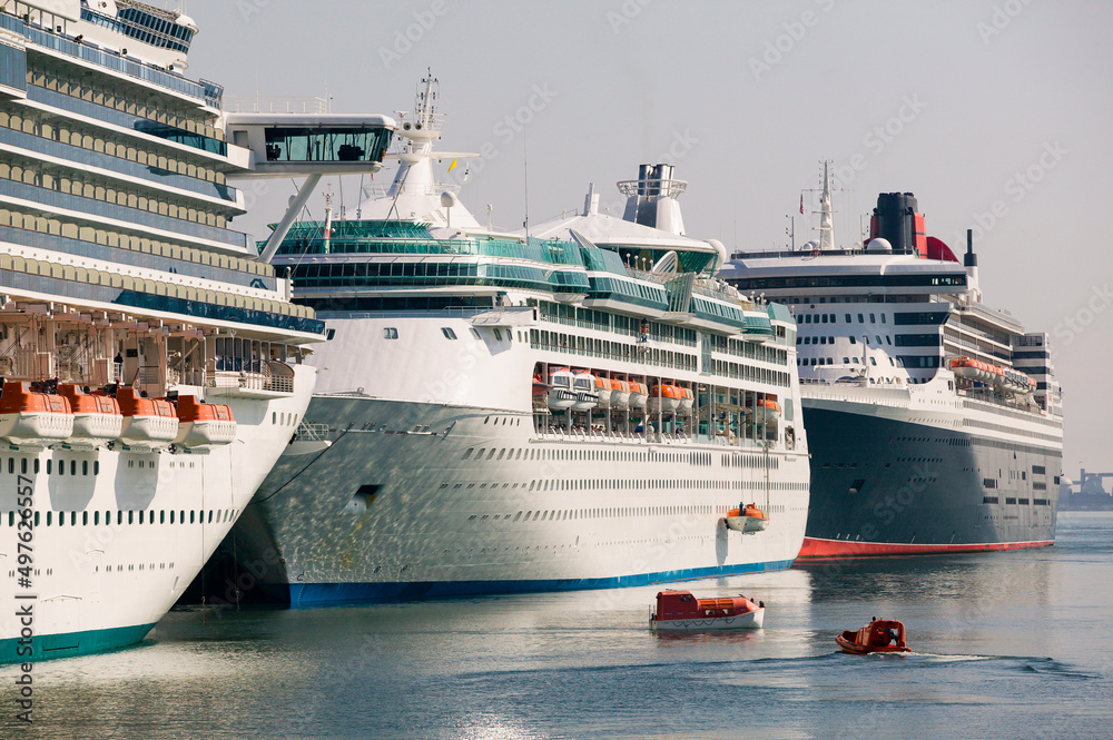 Cruise Ships in Port doing lifeboat safety drill Cruise Ships in Port doing lifeboat safety drill