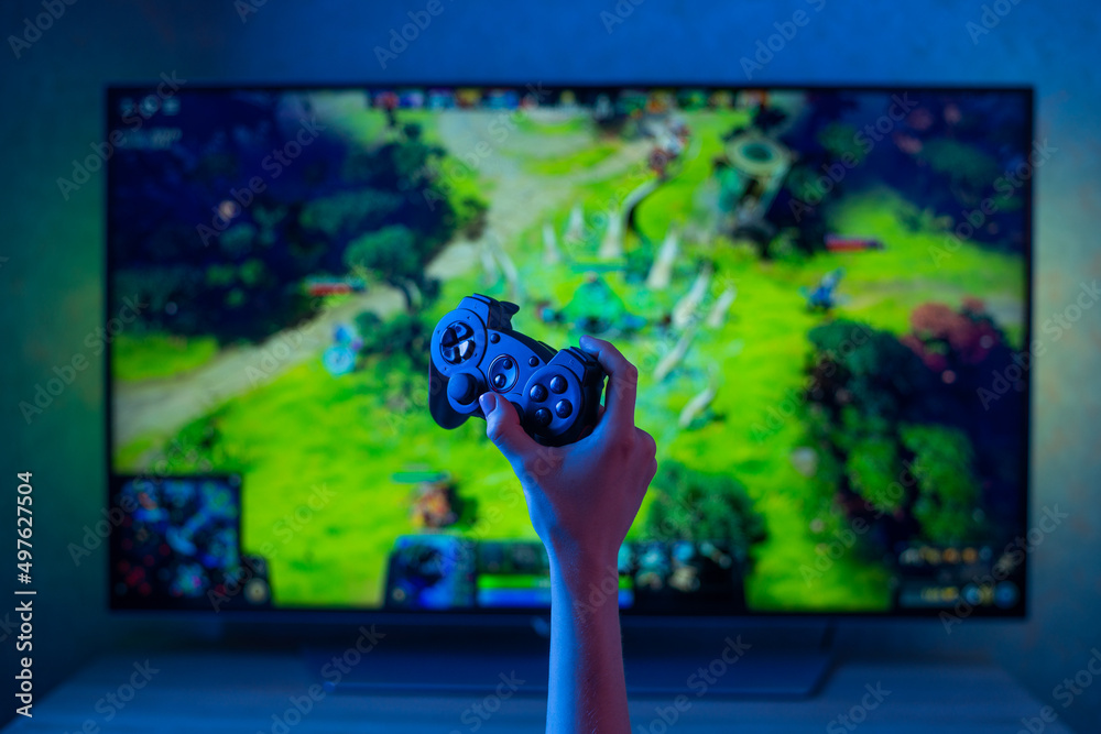 Gamepad on TV background Stock Photo | Adobe Stock