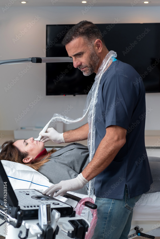 Male cosmetologist making skin care procedure to client Male cosmetologist making skin care procedure to client
