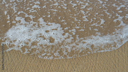 Schilderij op canvas Espuma de mar sobre arena