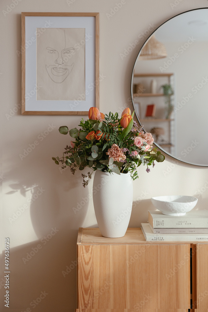Gentle flowers in ceramic vase in room Gentle flowers in ceramic vase in room