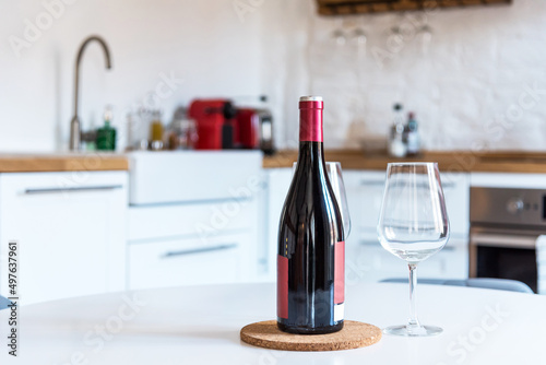 Close up of red wine bottle and glasses