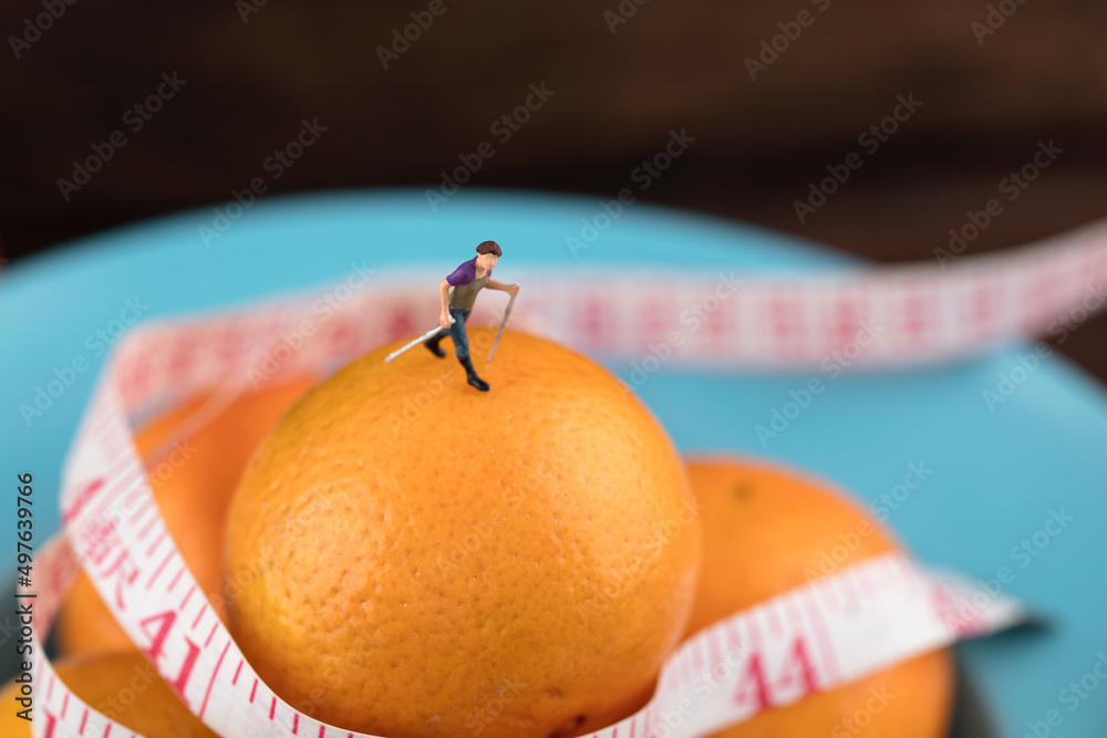 Obraz na plátně Miniature creative healthy life eat fruit more exercise