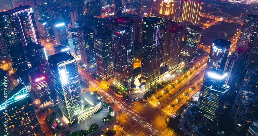 Aerial hyper lapse of Chengdu Cityscape at twilight  with buildings and traffic on the road