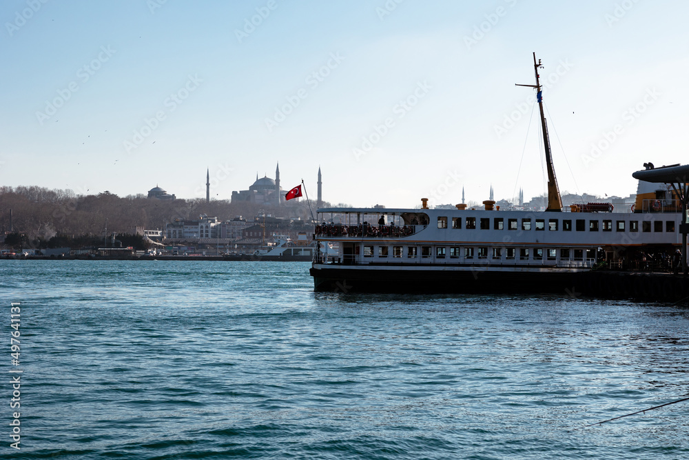 Famous ferries of Istanbul and Hagia Sophia on the background