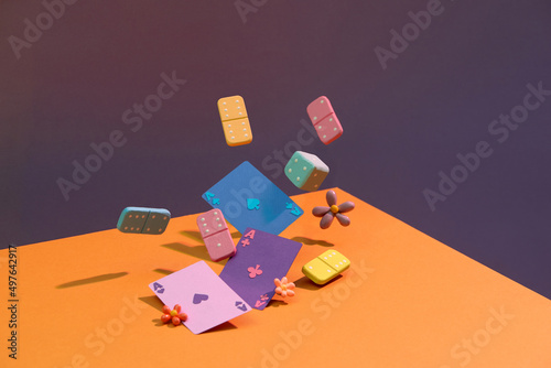 All attributes to play board games isolated over color photo