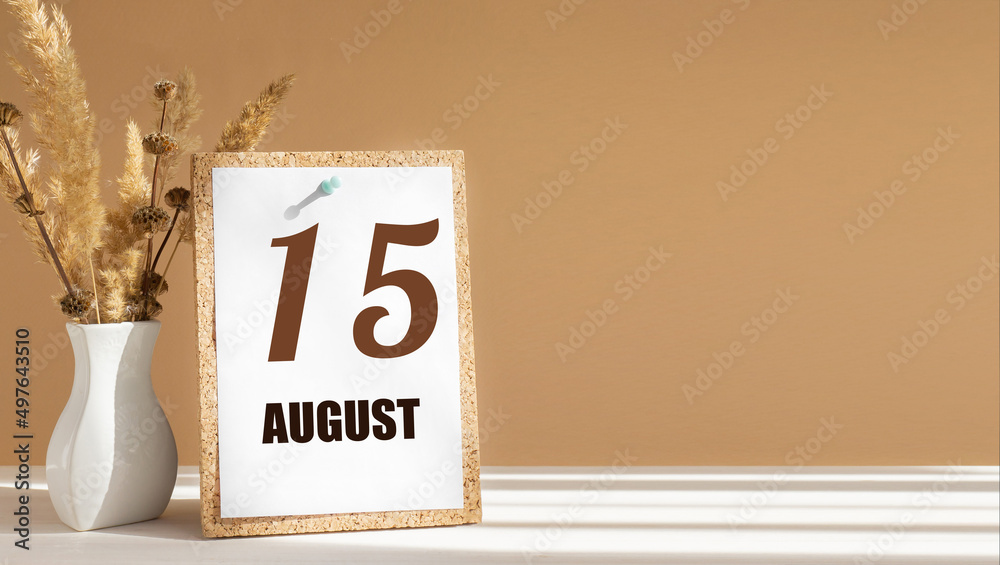 august 15. 15th day of month, calendar date.White vase with dead wood next to cork board with numbers. White-beige background with striped shadow. Concept of day of year, time planner, summer month - obrazy, fototapety, plakaty 