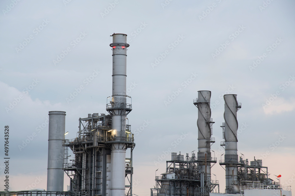 Oil refinery industry at sunset - factory - petrochemical plant Oil refinery industry at sunset - factory - petrochemical plant
