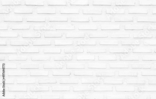 White grunge brick wall texture background for stone tile block painted in grey light color wallpaper design element.
