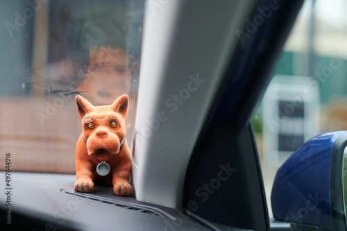 Vintage bobbing head dog in car window photo
