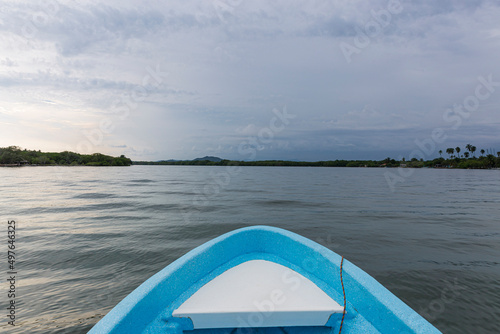 the front of a boat in the middle of a lagoon
