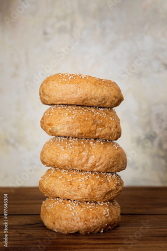 stacked bagels on a wooden table