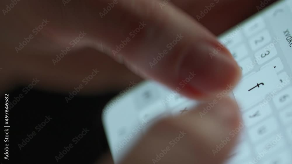 Female hands typing text on smartphone close-up