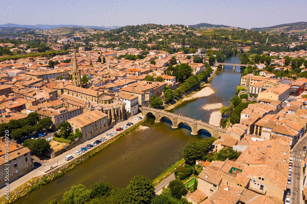 Aerial view of houses of Limoux old town and river Aude at sunny summer day, France