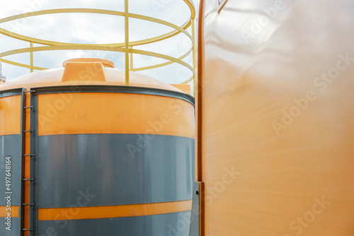 Yellow storage tank close-up. photo