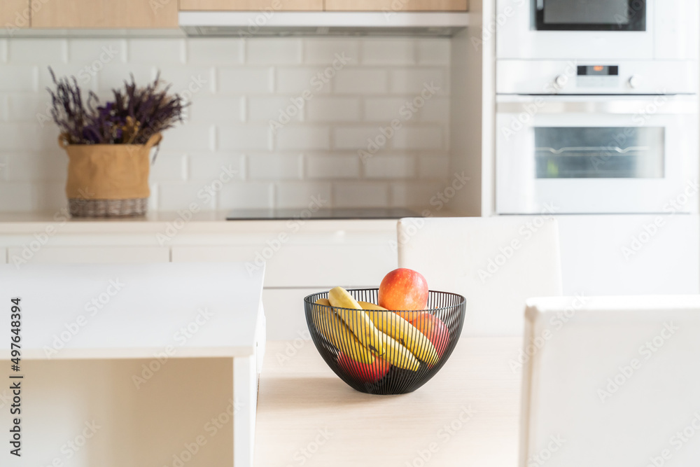 Bowl With Fruits On The Table Of The Kitchen Bowl With Fruits On The Table Of The Kitchen