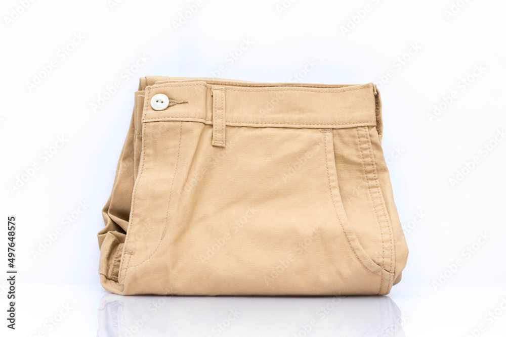 Brown denim fabric to stitch close-up on white background. Brown denim fabric to stitch close-up on white background.