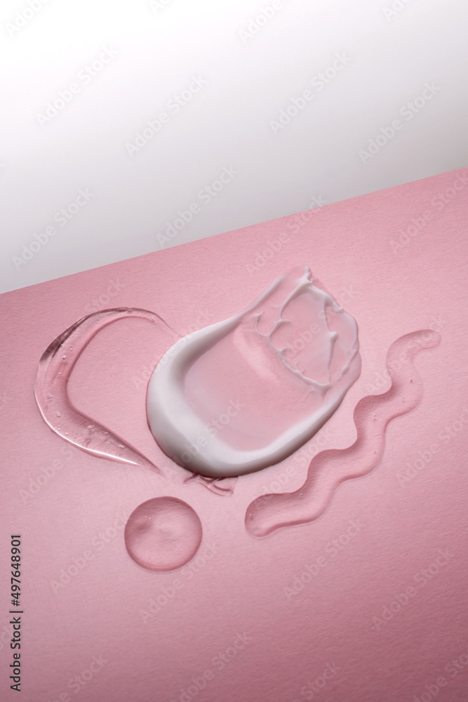Serum and cream on a pink background. Textures. Serum and cream on a pink background. Textures.