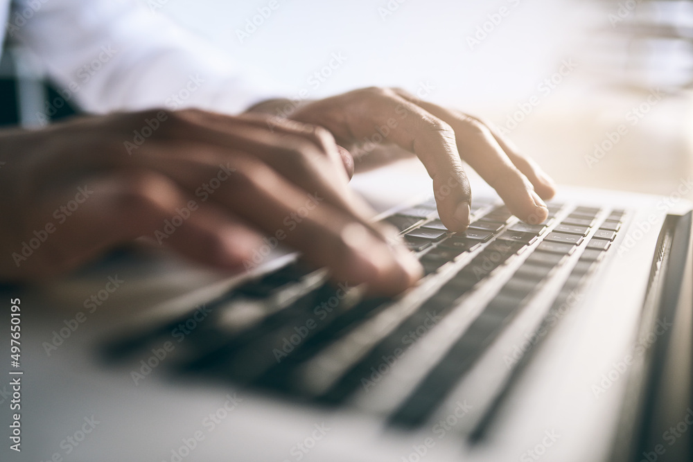 Fototapeta premium I have a lot of typing to do today. Closeup shot of a unrecognizable business person typing on a laptop keyboard.
