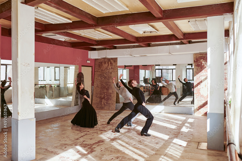Flamenco dancers rehearsing in a sunny studio Flamenco dancers rehearsing in a sunny studio