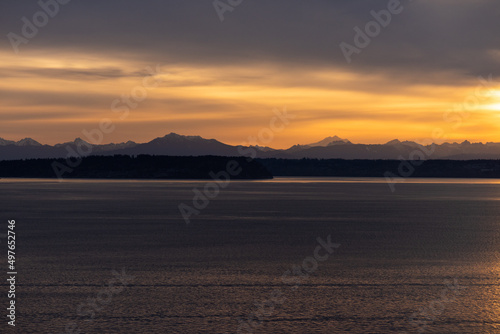 Pacific Northwest sunrise over mountains and bay of water on the Olympic Peninsula  Kingston Washington