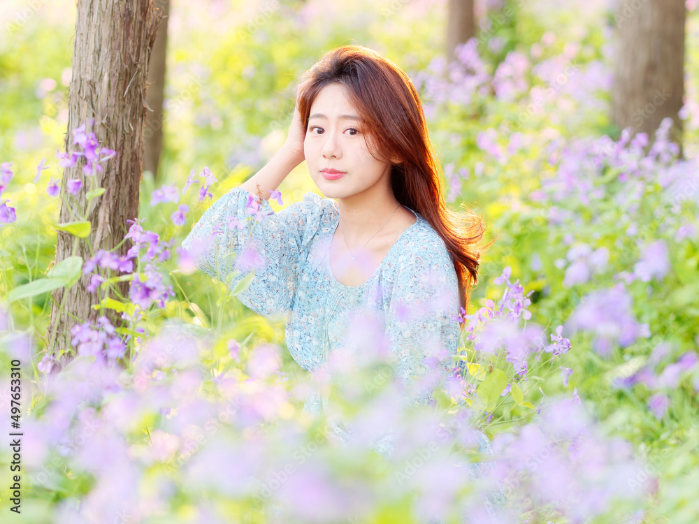 Portrait of elegant Chinese girl in dress enjoy carefree time in forest park in sunny day. Outdoor fashion portrait of glamour young Chinese cheerful stylish woman. Portrait of elegant Chinese girl in dress enjoy carefree time in forest park in sunny day. Outdoor fashion portrait of glamour young Chinese cheerful stylish woman.