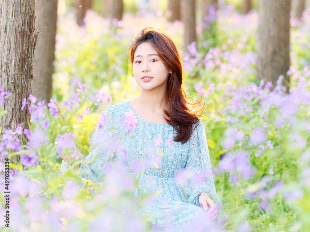 Portrait of elegant Chinese girl in dress enjoy carefree time in forest park in sunny day. Outdoor fashion portrait of glamour young Chinese cheerful stylish woman. Portrait of elegant Chinese girl in dress enjoy carefree time in forest park in sunny day. Outdoor fashion portrait of glamour young Chinese cheerful stylish woman.