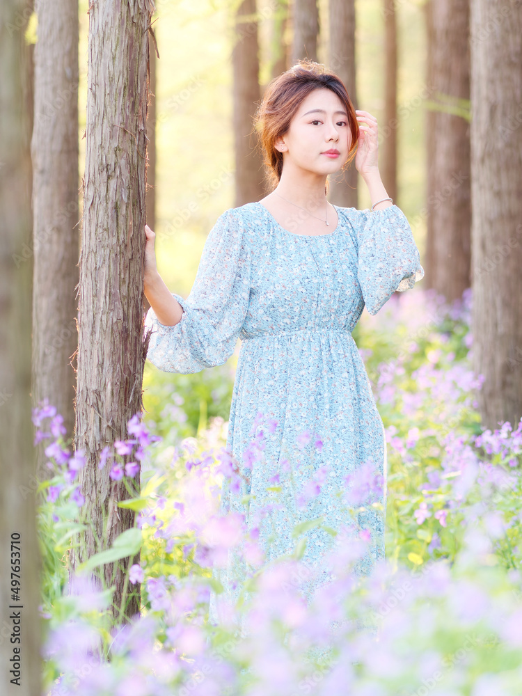 Portrait of elegant Chinese girl in dress enjoy carefree time in forest park in sunny day. Outdoor fashion portrait of glamour young Chinese cheerful stylish woman. Portrait of elegant Chinese girl in dress enjoy carefree time in forest park in sunny day. Outdoor fashion portrait of glamour young Chinese cheerful stylish woman.