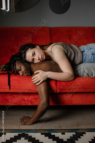 the girl lies thoughtfully on her boyfriend