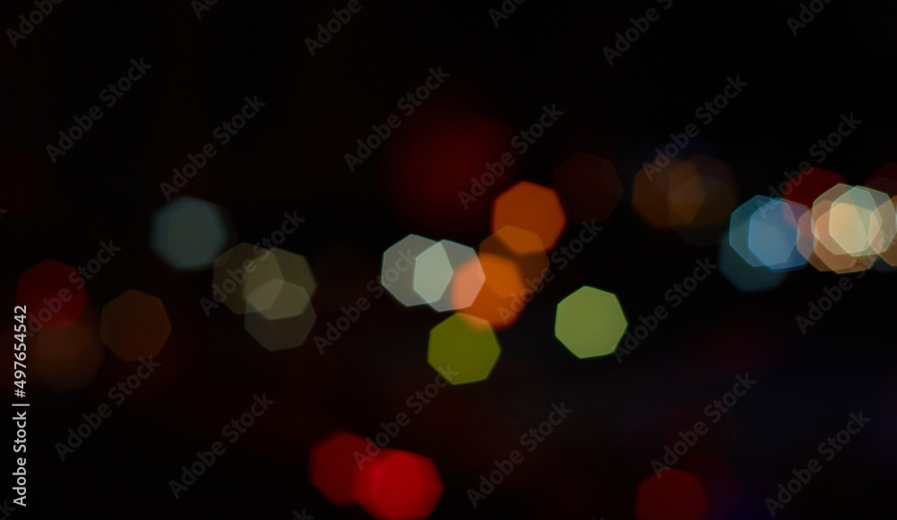 Fototapeta premium Dreamy light spots in the city at night