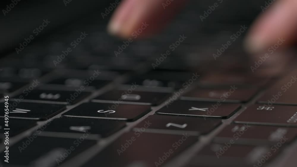 Macro close-up of female hands busy working on laptop or computer keyboard for send emails and surf on a web browser. Macro close-up of female hands busy working on laptop or computer keyboard for send emails and surf on a web browser.
