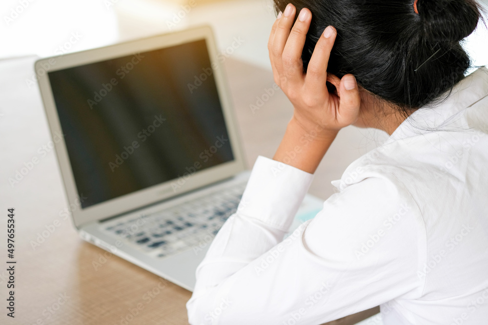 woman sitting down, his face unsettled. At the computer desk she has