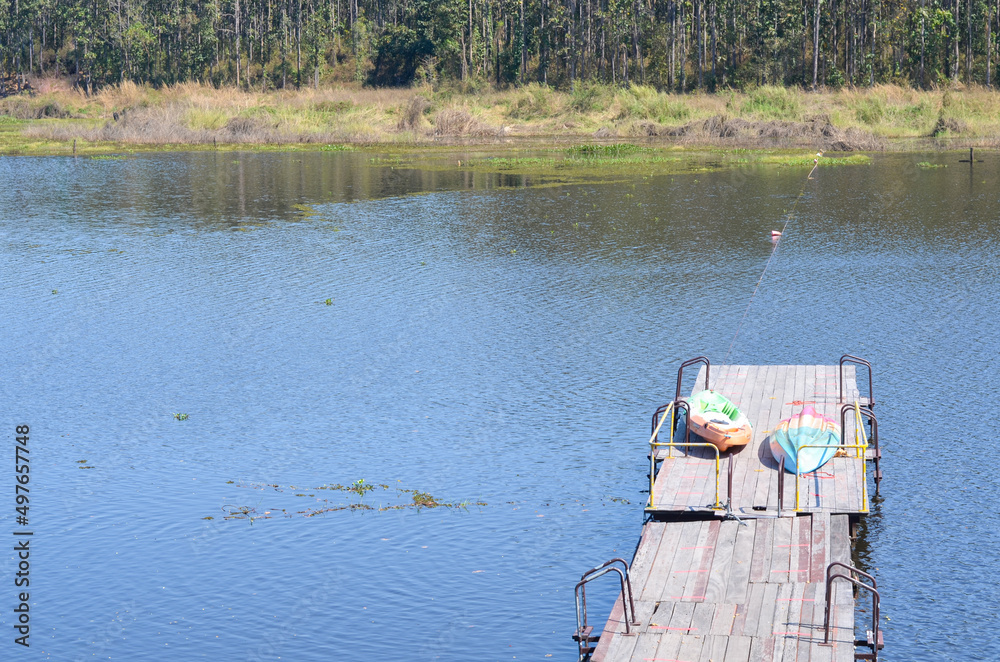 Fototapeta premium Blue lake and kayak at Maepuem national park at Phayao province of Thailand