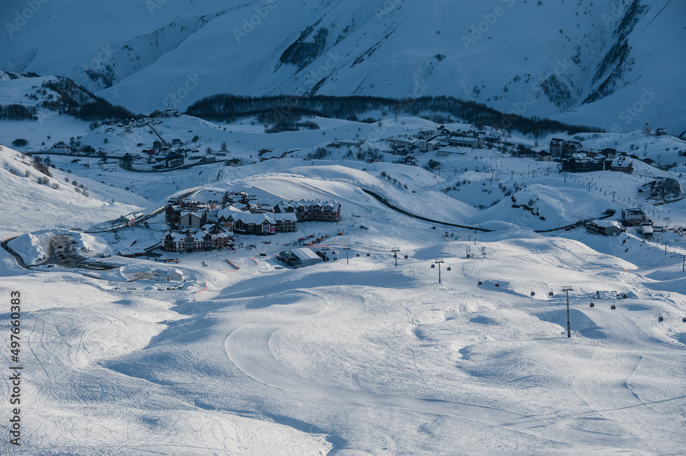 Snowy winter mountains in sun day. Georgia, from ski resort Gudauri. Snowy winter mountains in sun day. Georgia, from ski resort Gudauri.