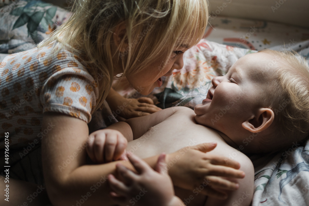 sister hugging brother