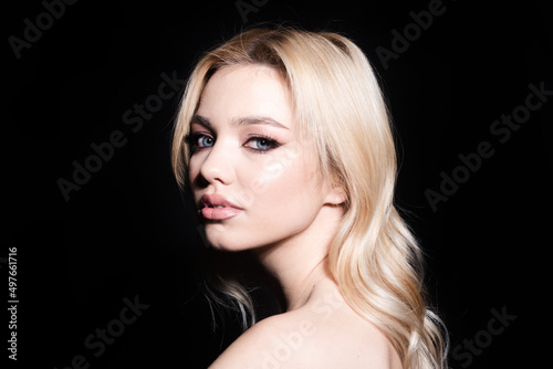 Beautiful woman with blue eyes. Close-up portrait  skin care  natural nude make-up. Skin care beauty woman. No filter unaltered female model face.